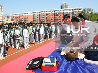 Volunteers from the Red Cross are explaining first aid at Xiyuan Middle School in Lianyungang, Jiangsu Province, East China, on May 8, 2024....