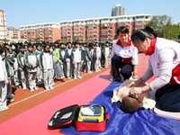 Volunteers from the Red Cross are explaining first aid at Xiyuan Middle School in Lianyungang, Jiangsu Province, East China, on May 8, 2024....