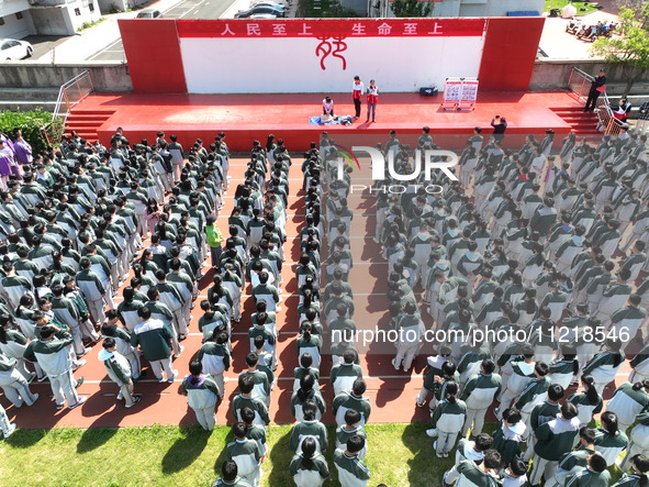 Volunteers from the Red Cross are explaining first aid at Xiyuan Middle School in Lianyungang, Jiangsu Province, East China, on May 8, 2024....