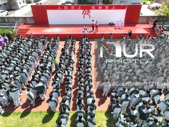 Volunteers from the Red Cross are explaining first aid at Xiyuan Middle School in Lianyungang, Jiangsu Province, East China, on May 8, 2024....