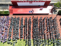 Volunteers from the Red Cross are explaining first aid at Xiyuan Middle School in Lianyungang, Jiangsu Province, East China, on May 8, 2024....