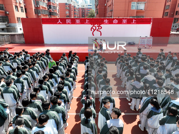 Volunteers from the Red Cross are explaining first aid at Xiyuan Middle School in Lianyungang, Jiangsu Province, East China, on May 8, 2024....