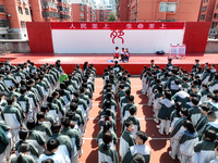 Volunteers from the Red Cross are explaining first aid at Xiyuan Middle School in Lianyungang, Jiangsu Province, East China, on May 8, 2024....