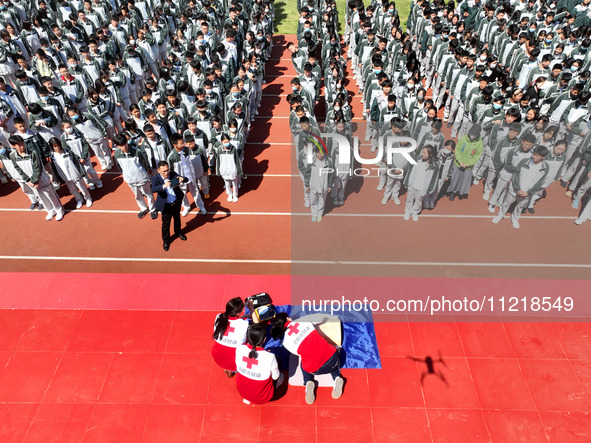 Volunteers from the Red Cross are explaining first aid at Xiyuan Middle School in Lianyungang, Jiangsu Province, East China, on May 8, 2024....