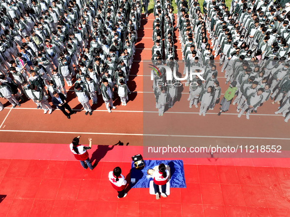 Volunteers from the Red Cross are explaining first aid at Xiyuan Middle School in Lianyungang, Jiangsu Province, East China, on May 8, 2024....