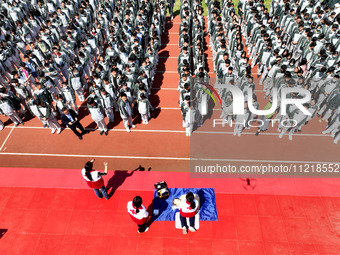 Volunteers from the Red Cross are explaining first aid at Xiyuan Middle School in Lianyungang, Jiangsu Province, East China, on May 8, 2024....