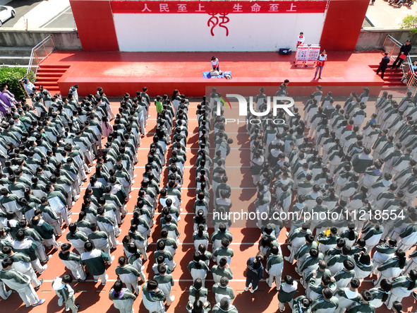 Volunteers from the Red Cross are explaining first aid at Xiyuan Middle School in Lianyungang, Jiangsu Province, East China, on May 8, 2024....