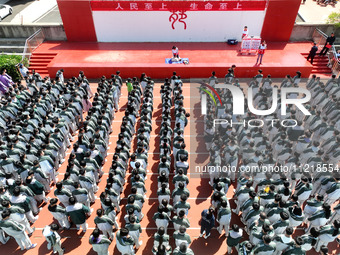 Volunteers from the Red Cross are explaining first aid at Xiyuan Middle School in Lianyungang, Jiangsu Province, East China, on May 8, 2024....