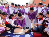 Volunteers from the Red Cross are explaining first aid at Xiyuan Middle School in Lianyungang, Jiangsu Province, East China, on May 8, 2024....