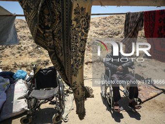 Displaced Palestinians are setting up tents on a beach near Deir el-Balah in the central Gaza Strip amid the ongoing conflict between Israel...