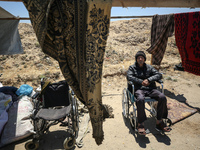 Displaced Palestinians are setting up tents on a beach near Deir el-Balah in the central Gaza Strip amid the ongoing conflict between Israel...