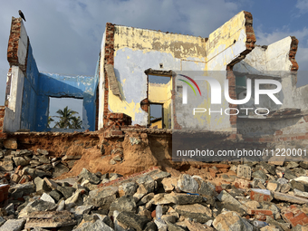 Houses are being destroyed by the ocean tides along Kollamkode Beach in Kollamkode, Kerala, India, on April 15, 2024. (