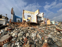 Houses are being destroyed by the ocean tides along Kollamkode Beach in Kollamkode, Kerala, India, on April 15, 2024. (