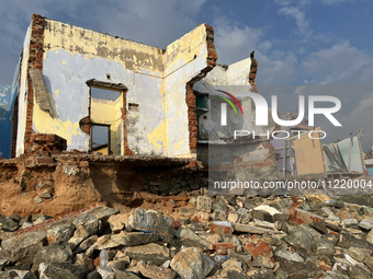 Houses are being destroyed by the ocean tides along Kollamkode Beach in Kollamkode, Kerala, India. (