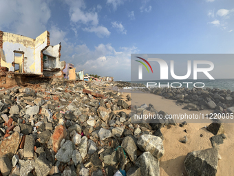 Houses are being destroyed by the ocean tides along Kollamkode Beach in Kollamkode, Kerala, India, on April 15, 2024. (