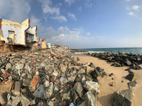 Houses are being destroyed by the ocean tides along Kollamkode Beach in Kollamkode, Kerala, India, on April 15, 2024. (