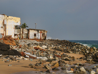 Houses are being destroyed by the ocean tides along Kollamkode Beach in Kollamkode, Kerala, India, on April 15, 2024. (