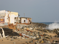 Houses are being destroyed by the ocean tides along Kollamkode Beach in Kollamkode, Kerala, India, on April 15, 2024. (