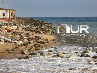 Houses are being destroyed by the ocean tides along Kollamkode Beach in Kollamkode, Kerala, India, on April 15, 2024. (