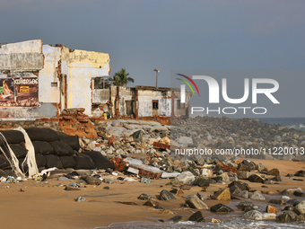 Houses are being destroyed by the ocean tides along Kollamkode Beach in Kollamkode, Kerala, India, on April 15, 2024. (