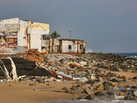 Houses are being destroyed by the ocean tides along Kollamkode Beach in Kollamkode, Kerala, India, on April 15, 2024. (