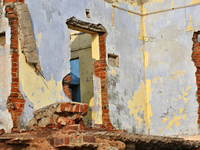 Houses are being destroyed by the ocean tides along Kollamkode Beach in Kollamkode, Kerala, India, on April 15, 2024. (