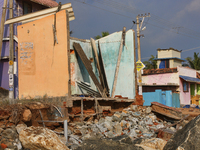 Houses are being destroyed by the ocean tides along Kollamkode Beach in Kollamkode, Kerala, India, on April 15, 2024. (