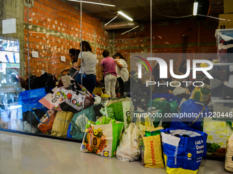 In Lisbon, individuals are gathering hygiene materials, water, clothes, and other items to send on flights to Brazil to address the emergenc...