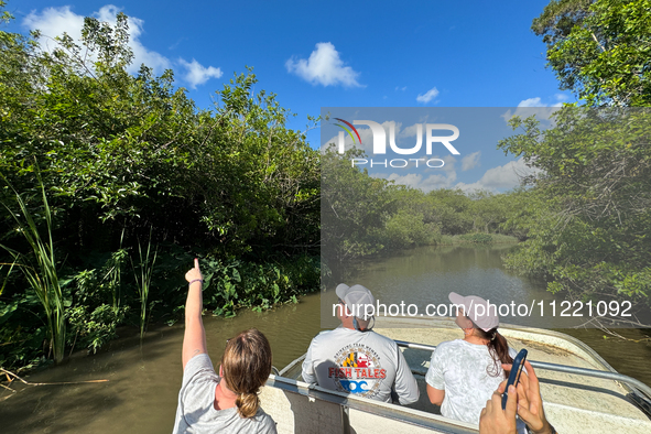 People take part in a boat tour in Everglades National Park, United States on May 6, 2024. 