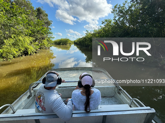 People take part in a boat tour in Everglades National Park, United States on May 6, 2024. (