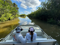 People take part in a boat tour in Everglades National Park, United States on May 6, 2024. (