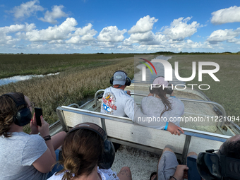 People take part in a boat tour in Everglades National Park, United States on May 6, 2024. (