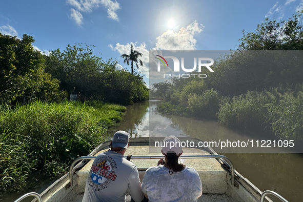 People take part in a boat tour in Everglades National Park, United States on May 6, 2024. 