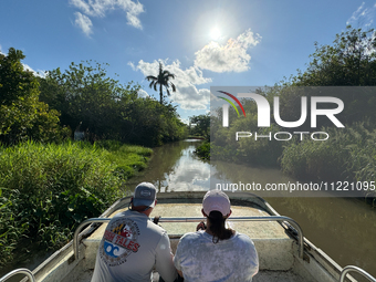 People take part in a boat tour in Everglades National Park, United States on May 6, 2024. (