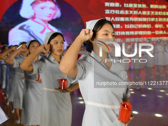 Students are taking an oath during a hat conferring ceremony at a nursing school in Yantai, Shandong Province, China, on May 8, 2024. (