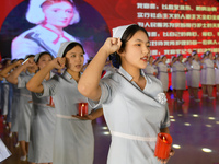 Students are taking an oath during a hat conferring ceremony at a nursing school in Yantai, Shandong Province, China, on May 8, 2024. (