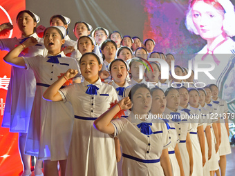 Students are taking an oath during a hat conferring ceremony at a nursing school in Yantai, Shandong Province, China, on May 8, 2024. (