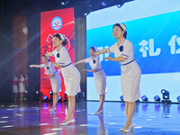 Students are performing etiquette exercises for nurses during a hat-awarding ceremony at a nursing school in Yantai, Shandong Province, Chin...