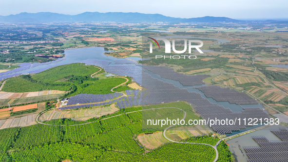 Solar photovoltaic panels are being lined up at the Gaogang Village photovoltaic power generation base in Yichun, China, on May 8, 2024. 