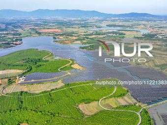 Solar photovoltaic panels are being lined up at the Gaogang Village photovoltaic power generation base in Yichun, China, on May 8, 2024. (