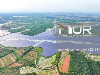 Solar photovoltaic panels are being lined up at the Gaogang Village photovoltaic power generation base in Yichun, China, on May 8, 2024. (