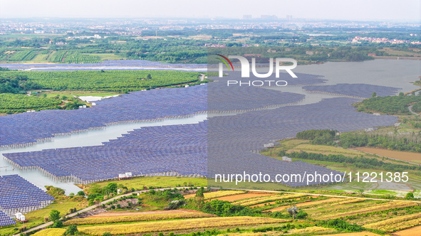 Solar photovoltaic panels are being lined up at the Gaogang Village photovoltaic power generation base in Yichun, China, on May 8, 2024. 