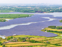 Solar photovoltaic panels are being lined up at the Gaogang Village photovoltaic power generation base in Yichun, China, on May 8, 2024. (