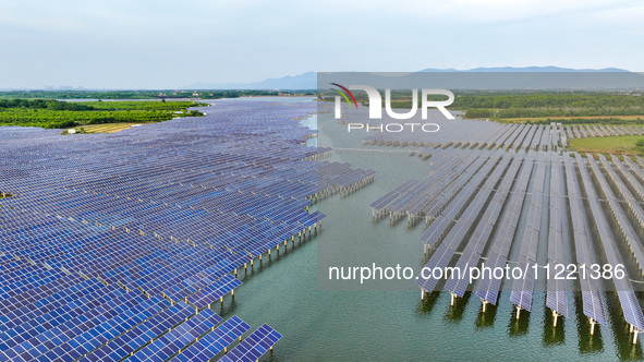 Solar photovoltaic panels are being lined up at the Gaogang Village photovoltaic power generation base in Yichun, China, on May 8, 2024. 