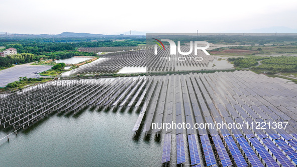 Solar photovoltaic panels are being lined up at the Gaogang Village photovoltaic power generation base in Yichun, China, on May 8, 2024. 