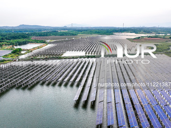 Solar photovoltaic panels are being lined up at the Gaogang Village photovoltaic power generation base in Yichun, China, on May 8, 2024. (