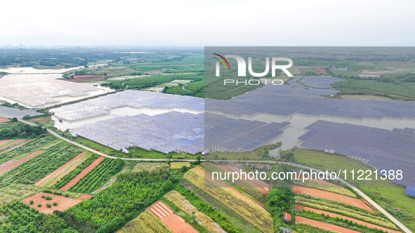 Solar photovoltaic panels are being lined up at the Gaogang Village photovoltaic power generation base in Yichun, China, on May 8, 2024. 