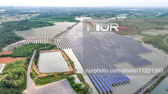 Solar photovoltaic panels are being lined up at the Gaogang Village photovoltaic power generation base in Yichun, China, on May 8, 2024. 