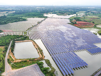 Solar photovoltaic panels are being lined up at the Gaogang Village photovoltaic power generation base in Yichun, China, on May 8, 2024. (