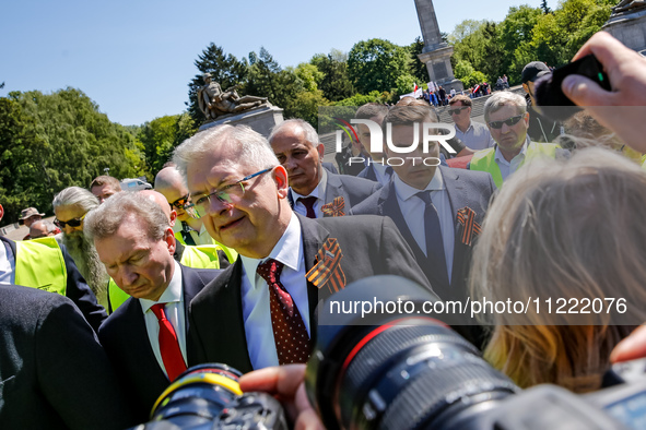 Sergey Andreyev, Russian Ambassador to Poland (C) lays flowers at the Mausoleum of the Soviet Soldiers Cemetery on Russian Victory Day, May...